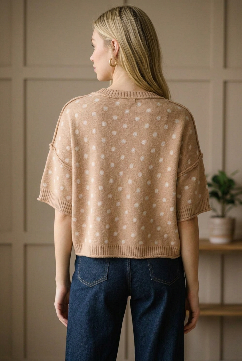Back view of a camel polka dot knit sweater top with a ribbed crew neckline and hip length ribbed hem