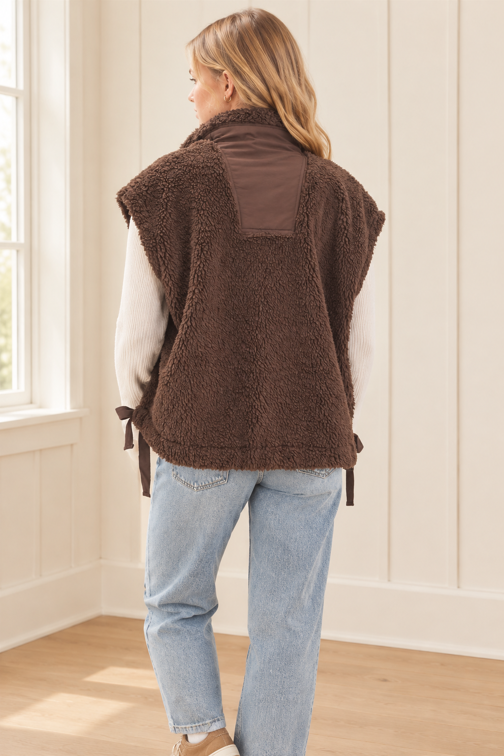 Brown high collar sherpa vest, back view showing boxy silhouette