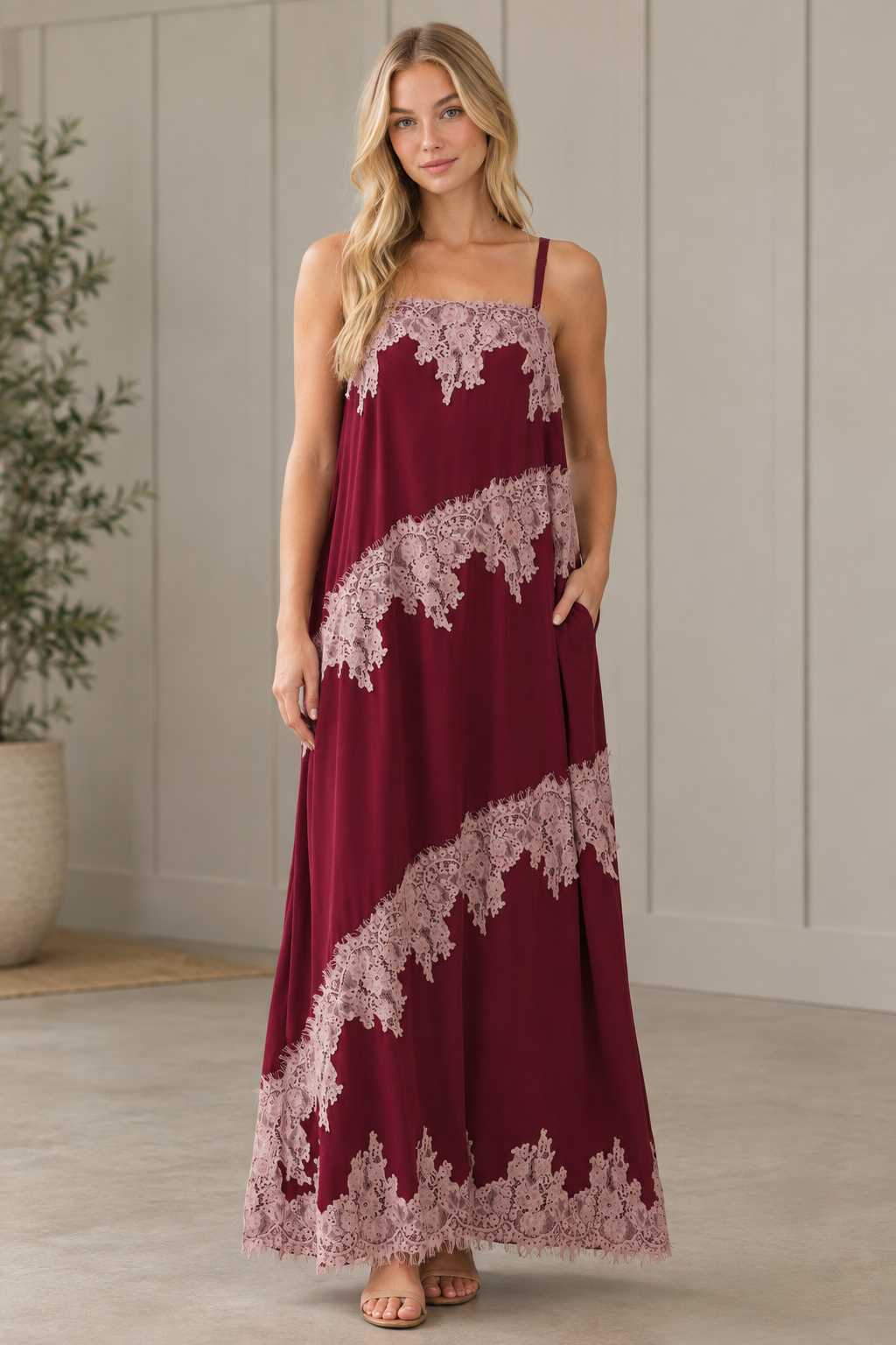 Burgundy lace trim maxi dress in three quarter view showing side pocket and relaxed silhouette