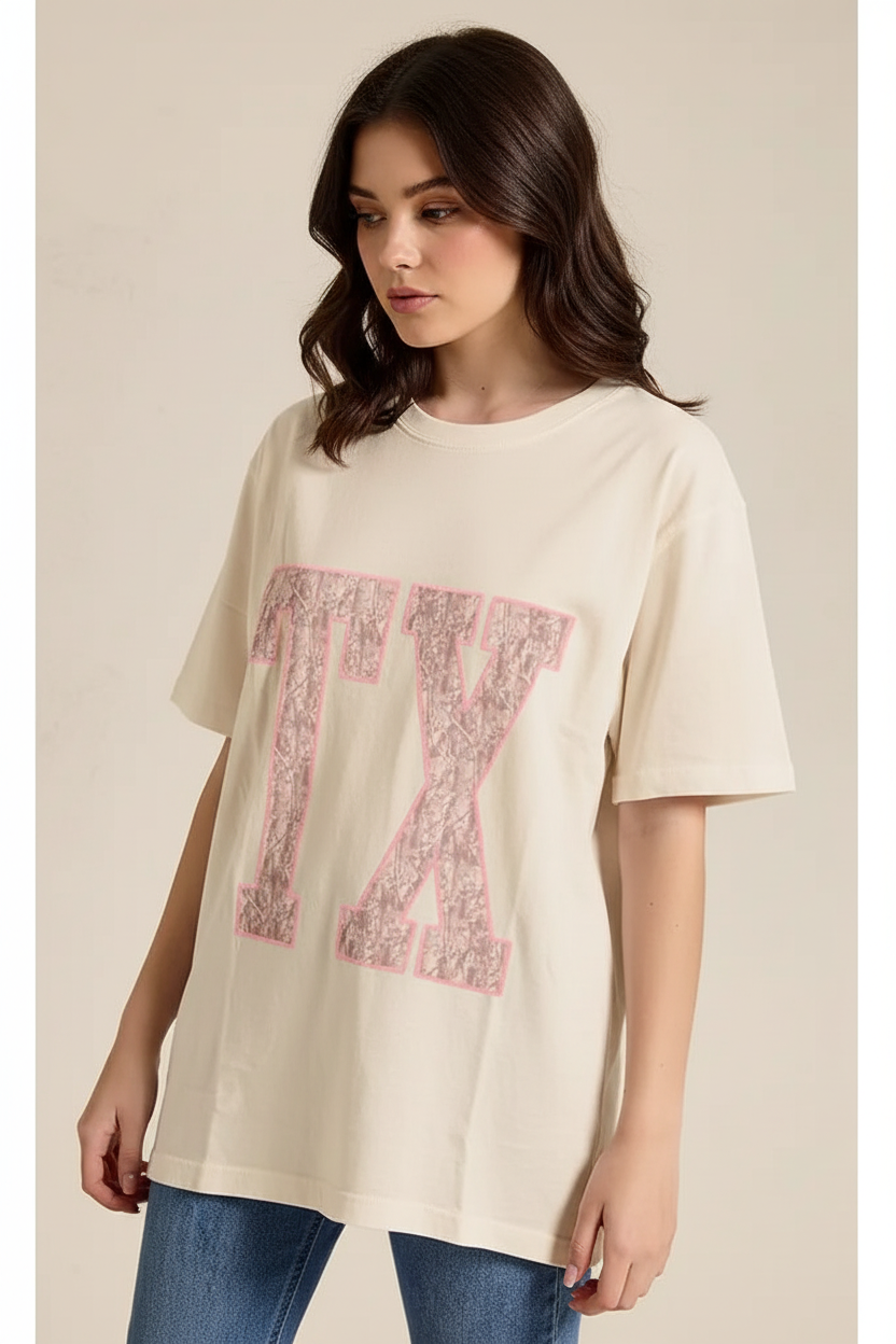 Zutter TX graphic oversized boutique t-shirt from Thread Bar Boutique featuring pink puff print lettering and vintage cream wash cotton.