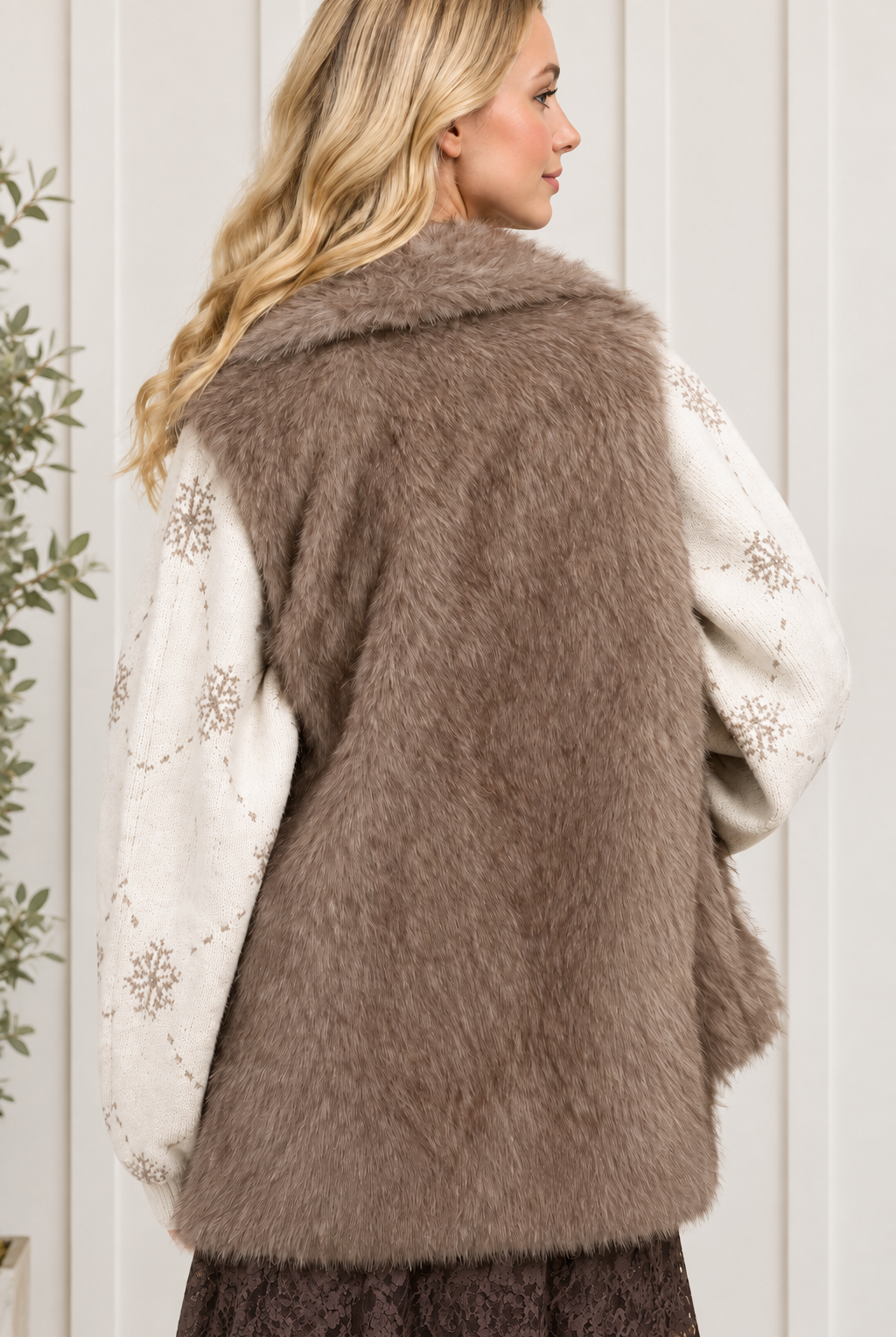 Back view of taupe faux fur vest showing the shawl collar, textured finish and hip-length hem
