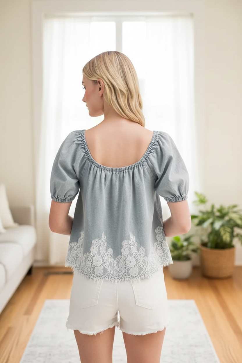 Lace denim top back view in front of window