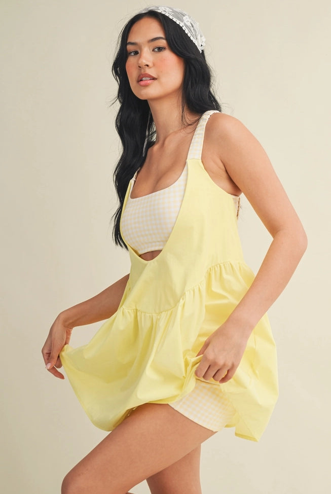 fit and flare go in this gingham dress layered