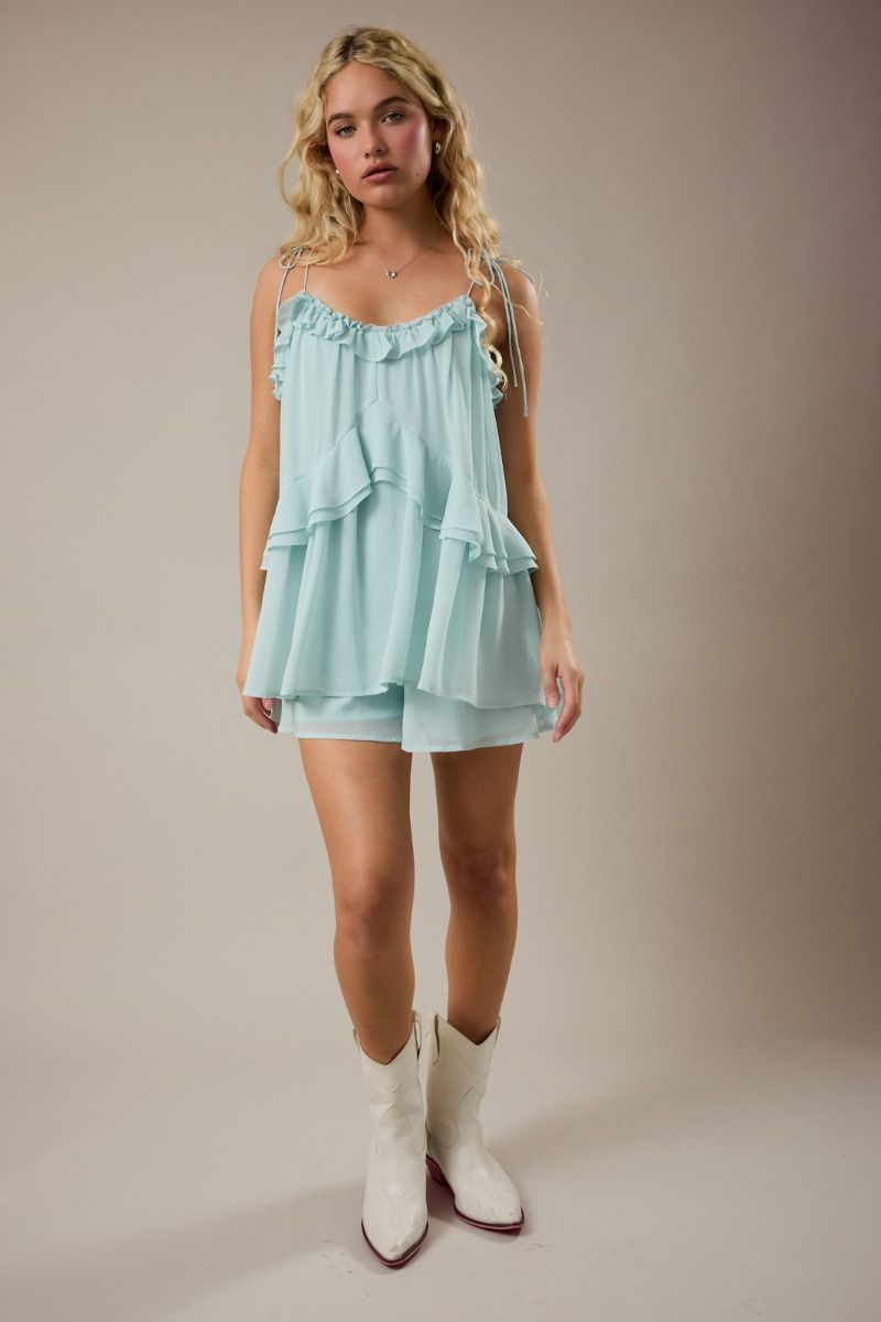 Thread Bar Boutique mint green romper featuring ruffle trim, flowy silhouette, and adjustable tie straps for an effortless feminine summer look.