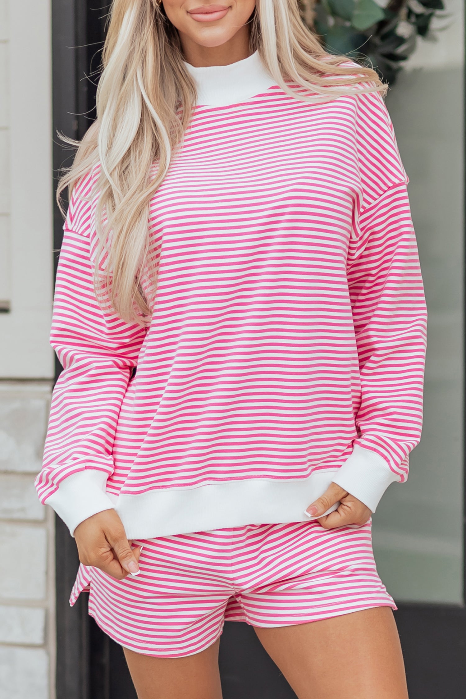 Trendy pink striped sweatshirt and shorts set from Thread Bar Boutique with oversized fit and soft lightweight fabric