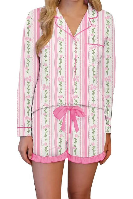 Pink striped floral pajama set featuring breathable fabric, relaxed fit button down top, and ruffled shorts for everyday lounging