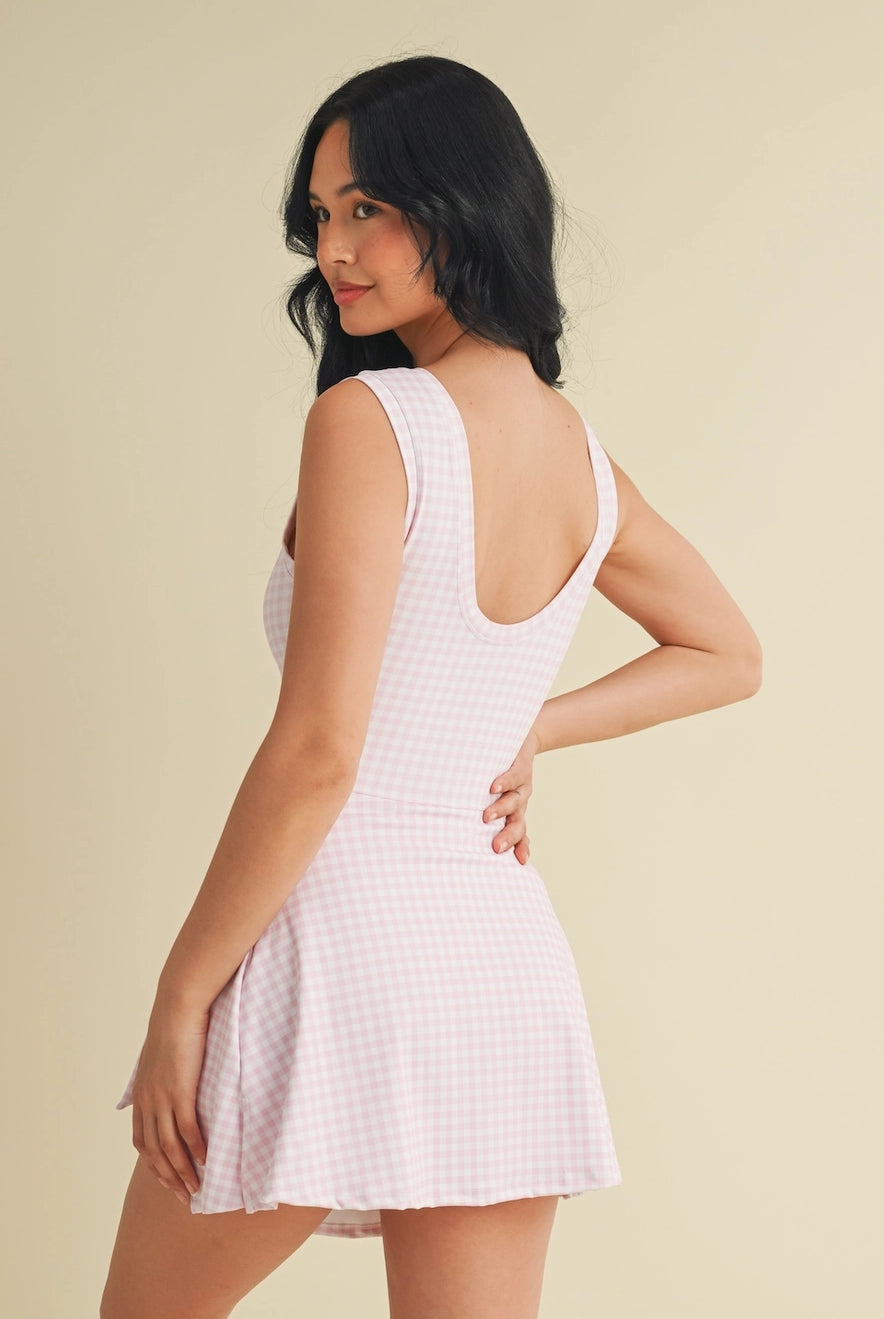 Lightweight pink gingham workout dress with wrap tie front from Thread Bar Boutique tennis inspired style
