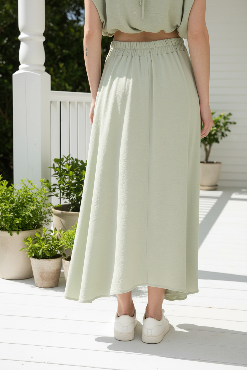 Sage green skirt detail - back view on porch