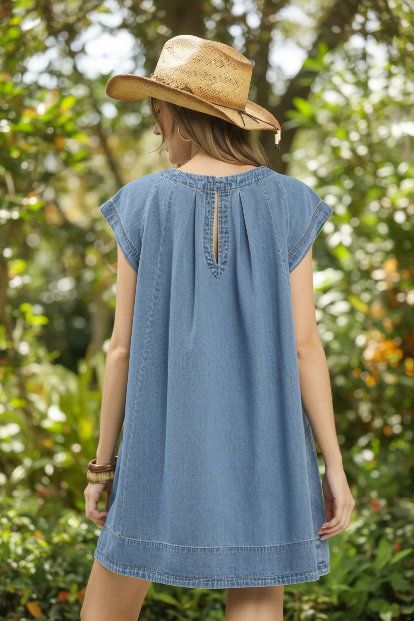 Umgee Brand Women’s stone washed denim mini dress from Thread Bar Boutique featuring pleated bodice, cap sleeves, and lightweight cotton blend denim.