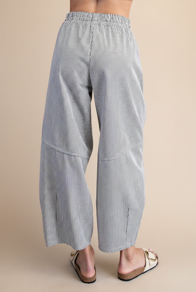 Striped wide-leg pants worn curved seam flattering fit