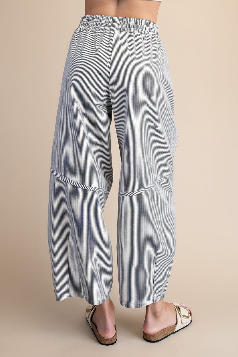 Striped wide-leg pants worn curved seam flattering fit