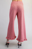 Red and white gingham wide-leg pants with ruffled hems, high waist and discreet back zipper front pockets