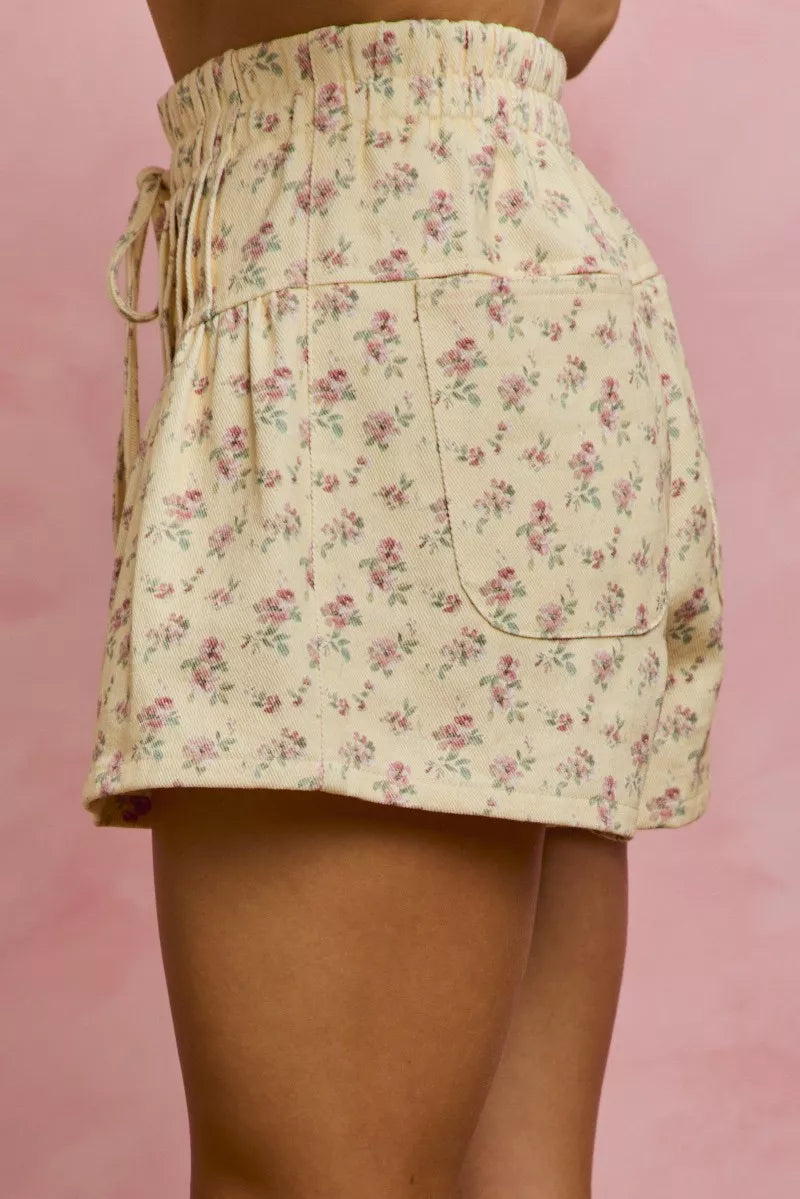 butter yellow button pink tuck shorts with floral print side view