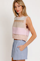 A fashionable round neck sweater vest with a sleeveless design, perfect for layering over blouses or wearing solo for a sleek, modern look. Ideal for creating preppy, casual, or chic outfits year-round.