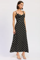 Romantic polka dot dress with flattering bustier silhouette. Thread Bar Boutique