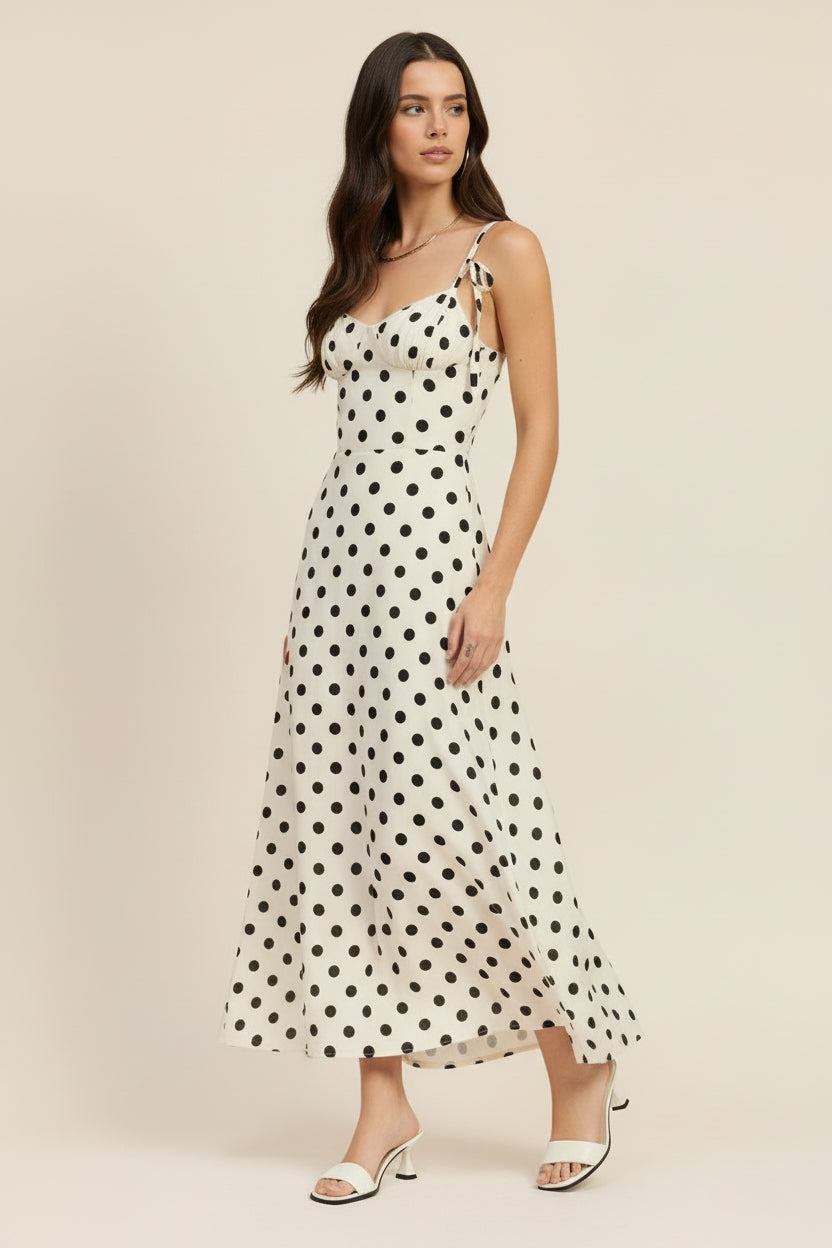 Flowy maxi dress with classic polka dot print and fitted bodice Thread Bar Boutique