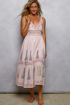 Women’s floral cotton midi dress with smocked waist and pearl accents from Thread Bar Boutique