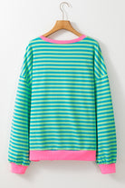 Women’s Casual Cool Stripe Oversized Sweatshirt with drop shoulder and contrast trim in relaxed fit, styled with denim