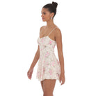 A model wearing a floral lace mini dress with a sweetheart neckline, adjustable spaghetti straps, and a skater-style silhouette. The dress is fully lined, and features delicate lace fabric, perfect for a feminine and trendy look.