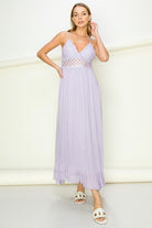 Model wearing an elegant lace maxi dress with a bustier-style bodice and flowing skirt, styled for a romantic formal occasion.