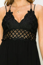 Model wearing an elegant lace maxi dress with a bustier-style bodice and flowing skirt, styled for a romantic formal occasion.