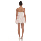 A model wearing a floral lace mini dress with a sweetheart neckline, adjustable spaghetti straps, and a skater-style silhouette. The dress is fully lined, and features delicate lace fabric, perfect for a feminine and trendy look.
