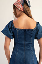 Mineral washed denim puff sleeve midi dress with square neckline and smocked back for women from Thread Bar Boutique