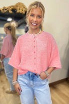 Women’s boxy knit button-down cardigan with 3/4 sleeves styled casually