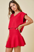 red knit v neck sweater cap sleeve with swing skirt worn as a set