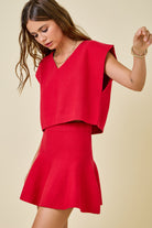 red knit v neck sweater cap sleeve with swing skirt worn as a set side view