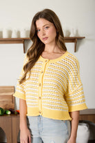 Buttery yellow and white striped knit cardigan in relaxed boxy fit with 3/4 sleeves