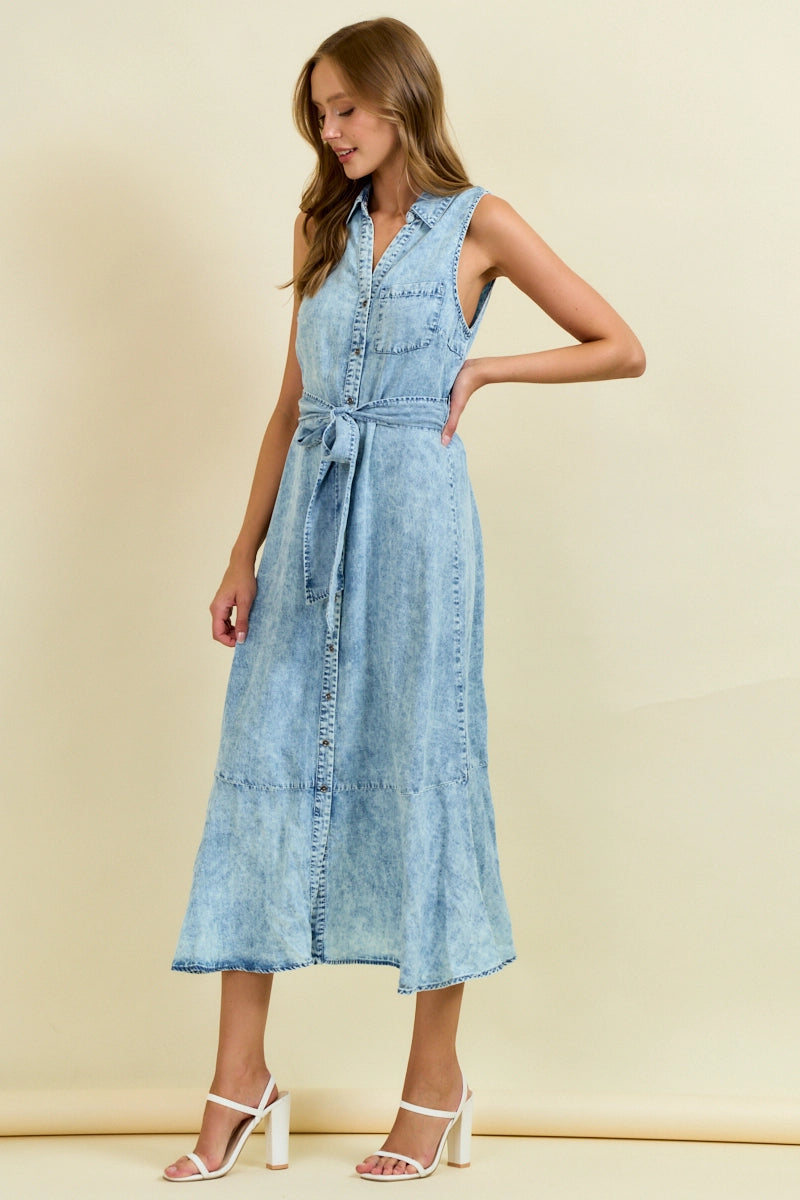 Sleeveless light wash denim midi dress with button front, tie waist belt, and ruffle hem