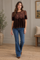 Romantic brown velvet and crochet-style top at Thread Bar Boutique, featuring a sheer textured upper panel, intricate lace front, scalloped mesh trim, puff sleeves, and a relaxed babydoll fit.