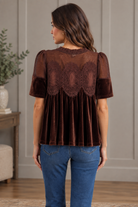Brown velvet lace top from Thread Bar Boutique featuring a sheer crochet-style yoke, delicate lace front detailing, scalloped mesh accents, short puff sleeves, and an easy flowing babydoll silhouette.