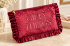 Thread Bar Boutique soft pink velvet cosmetic pouch featuring embroidered “The Essentials” or “Girly Things” lettering, ruffle trim, and zip closure for makeup and beauty essentials