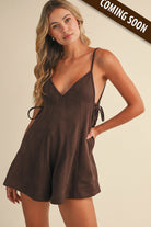 Chocolate brown textured flare romper with V-neckline, spaghetti straps, tie-side waist, and short flared hem