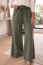 Women’s wide-leg pants with an adjustable drawstring waistband, comfortable cotton fabric, and functional pockets