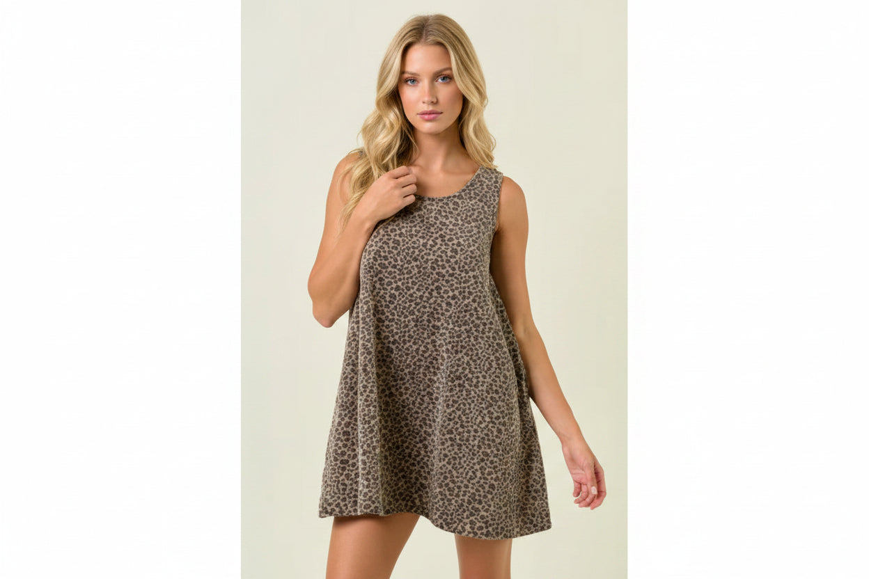 Fashionable leopard print mini dress for women with a relaxed silhouette, sleeveless cut, hidden pocket, and lightweight cotton fabric.
