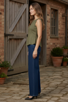 Women's fitted suede peplum top showing structured waist, flared peplum hem, and flattering hourglass silhouette
Fitted Suede Peplum Top