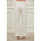 Structured high-rise barrel leg pants with full-length side panel seams, belt loops, button zipper closure, and front pockets