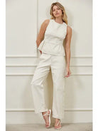 High-waisted barrel leg woven pants with structured waistband, side panel seams, and front pockets, matching peplum top set