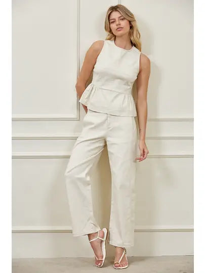 High-waisted barrel leg woven pants with structured waistband, side panel seams, and front pockets, matching peplum top set