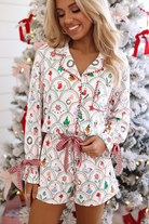 Women’s holiday pajama set with scallop pattern, plaid accents, notched collar, button-front top, ribbon knot waist, and pockets