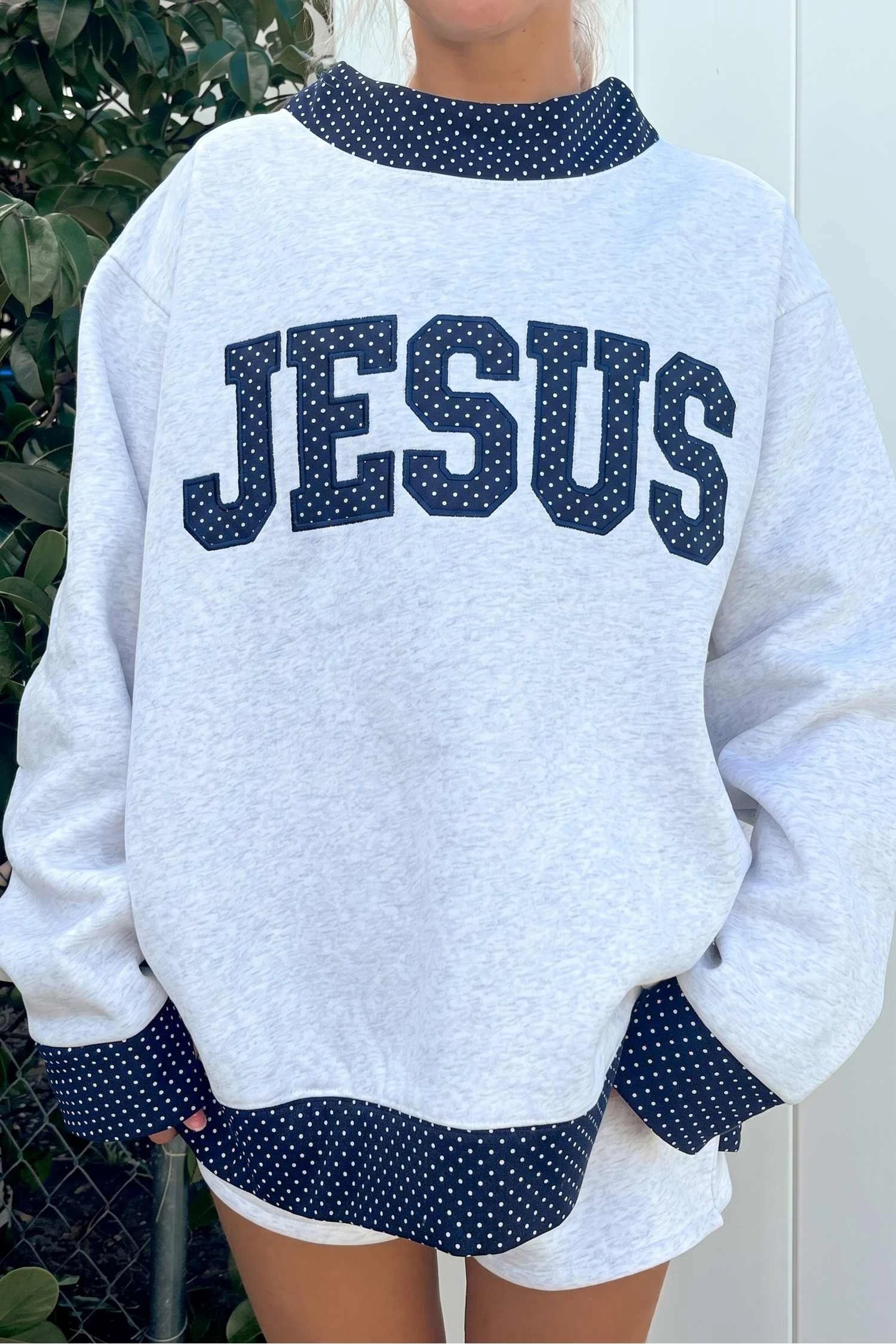 Light grey JESUS sweatshirt for women with playful polka dot colorblock trim on the mock neck, cuffs, and hem