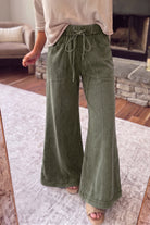 Jungle green mineral wash pants with dimensional color variation, seam detail, and functional front pockets