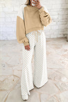 Khaki women’s matching set with a cropped crew neck sweatshirt, long balloon sleeves, ribbed cuffs, and relaxed wide-leg pants with an elastic drawstring waist.