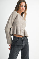 Soft taupe button-down knit peplum jacket with defined waist, cozy and elegant everyday layering piece.