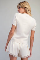 Cropped Martini sweater with rhinestone cocktail glass embellishment, ribbed crew neckline, and short sleeves from Thread Bar Boutique
