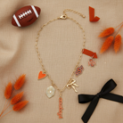 Gold paperclip chain Oklahoma State Cowboys necklace with logo charm flat lay