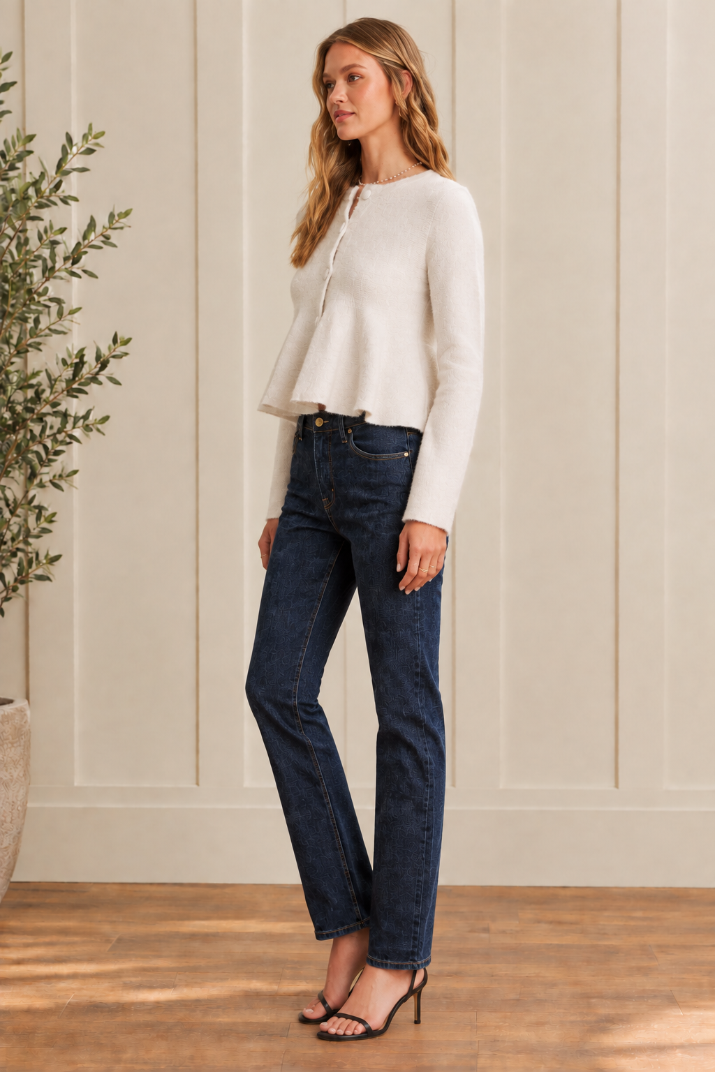 Thread Bar Boutique feminine peplum cardigan in a wool blend with fitted bodice, flared hem, covered buttons, round neckline, and cropped length, ideal for styling with denim, skirts, and tailored pants.